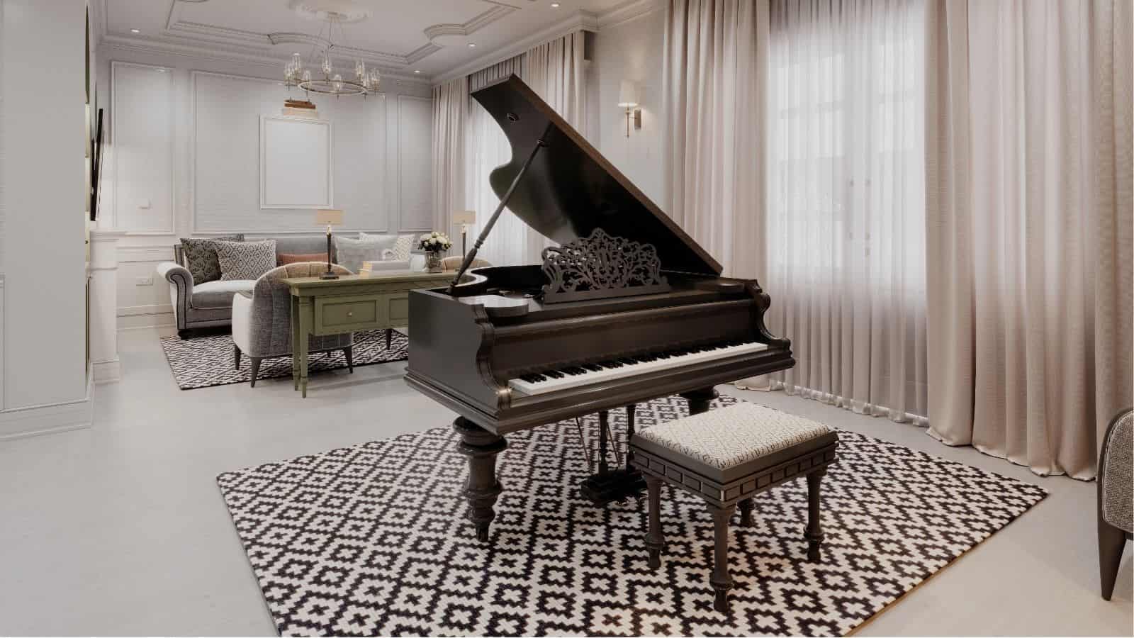 A black grand piano and matching bench sit on a geometric-patterned rug in a bright, elegant living room with neutral decor and large windows with sheer curtains.
