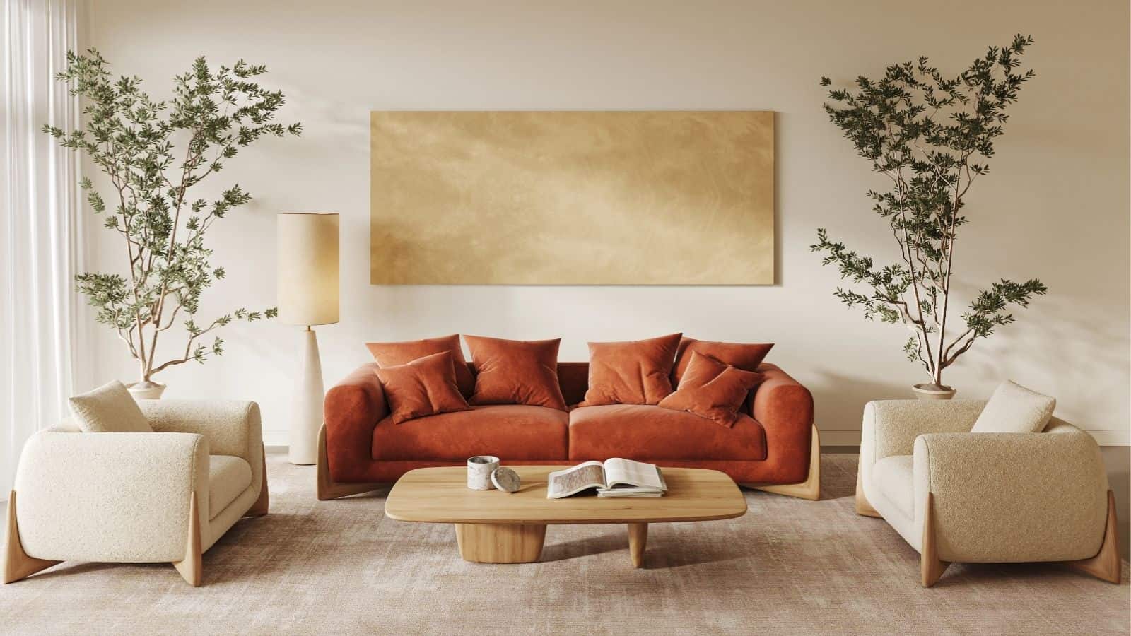 A modern living room with a rust-colored sofa, beige armchairs, a wooden coffee table, large potted plants, a floor lamp, and a gold abstract wall art piece.
