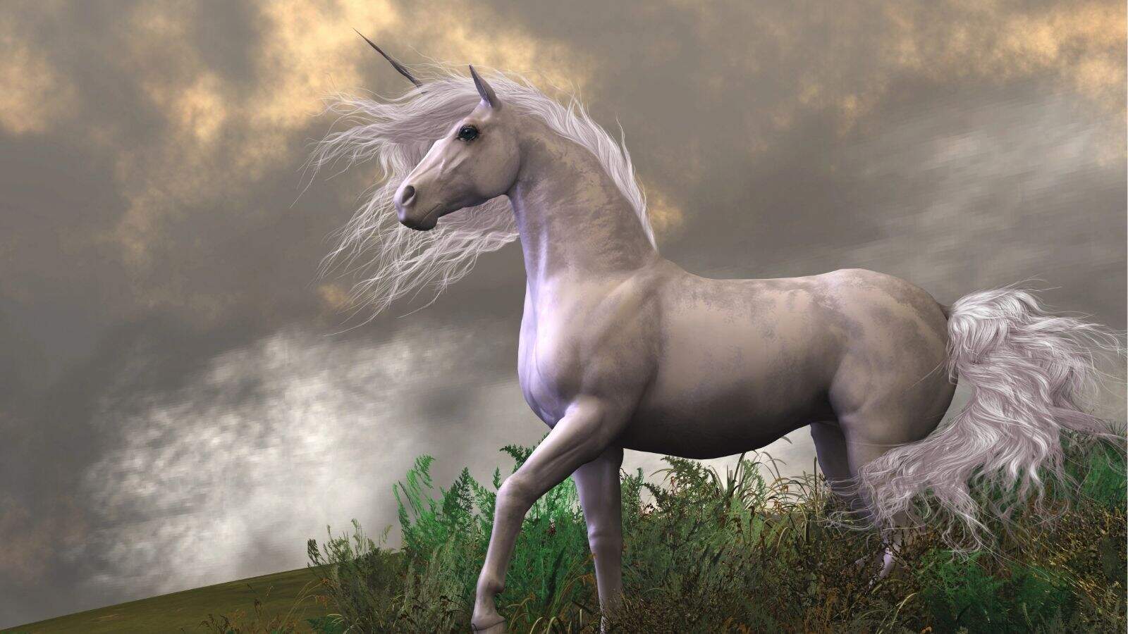 A white unicorn with a long mane and tail stands on grassy terrain against a cloudy sky.